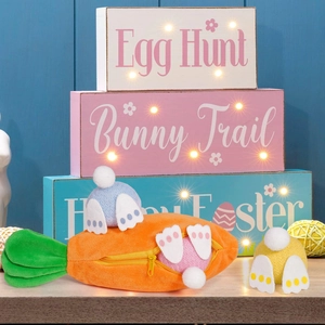 Detail of plush carrot zipper pouch with cute colorful mini bunnies for Easter decor