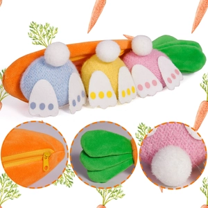 Detail of plush orange carrot pouch with zipper showing three colorful stuffed Easter bunnies