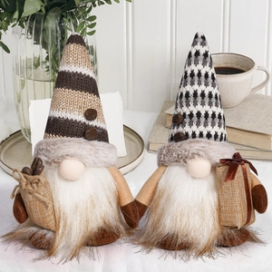 Detail of coffee gnomes with knitted hats, plush beards, and miniature coffee bean bags