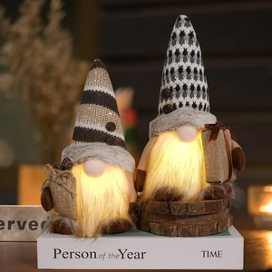 Detail of LED glowing gnomes with knitted hats and warm fiber beards on a wooden base