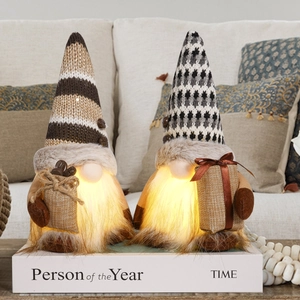 Close-up of glowing coffee gnomes with warm LED lights and knitted texture hats