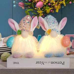 Detail of LED glowing Easter gnomes with sequin hats and bunny ears holding eggs