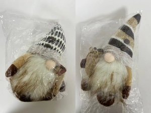 Close-up of knit coffee gnome ornaments with glowing light and miniature burlap bags