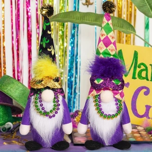 Detailed view of two Mardi Gras gnomes with sequin masks and festive bead necklaces