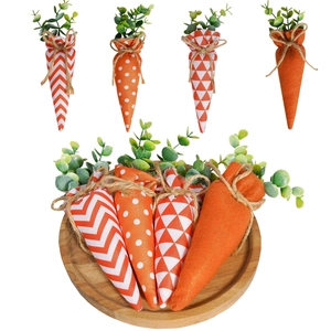 Detail of Easter fabric carrot ornaments with patterns on a round wooden tray