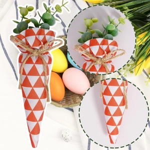 Detail of Easter carrot bags with orange geometric patterns and rustic jute twine bows