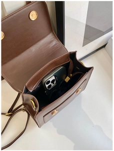 Detail view of the spacious interior of a dark brown faux leather vintage backpack