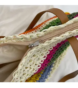Detail showing the smooth zipper closure on this rainbow woven straw tote beach bag