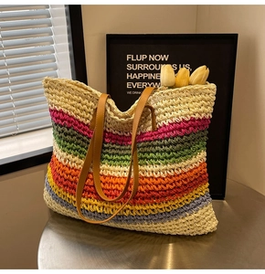 Close-up of rainbow striped woven tote bag with brown PU straps and tulip accents