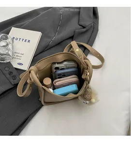 Top view showing the spacious interior of this retro bucket bag with daily essentials