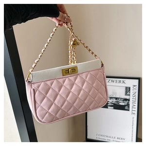 Detail of pink and white quilted chain bag with vintage gold turn-lock and leather strap