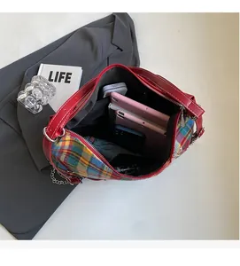 Top view showing large capacity of canvas tote bag with phone, umbrella and notebook