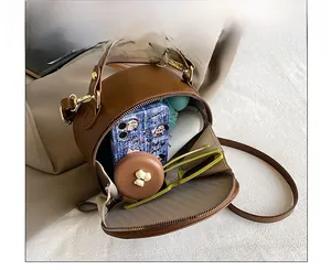 Interior view of brown wave pattern round bag showing capacity for daily essentials