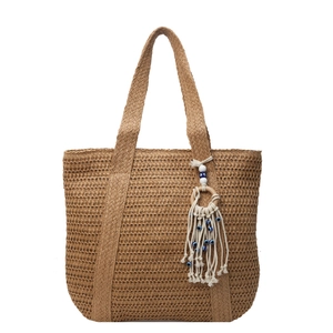 Large woven straw tote bag with evil eye tassel charm for beach vacations and daily use
