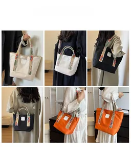 Multi-angle view of tote bag featuring ethnic embroidered strap and logo detail
