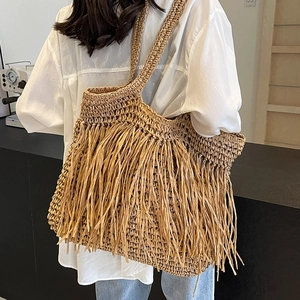 Large capacity straw tote bag with tassels for beach vacations and bohemian style