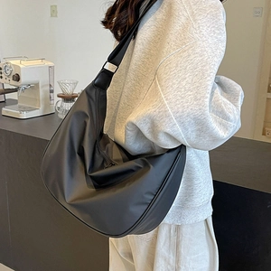 Minimalist black oxford cloth crescent crossbody bag with adjustable wide shoulder strap
