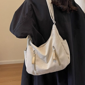 Grand sac cabas en toile beige pour femme avec doubles poches zippées et bandoulière