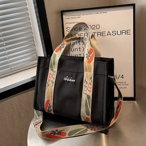 Large capacity black canvas tote bag with floral wide strap and embroidery details