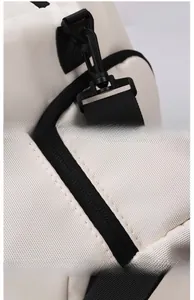 Detail of durable Oxford fabric with black hardware and reinforced stitching for travel bag