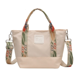 Canvas tote bag with vintage floral jacquard handles and detachable crossbody strap