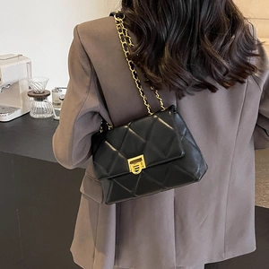 Classic black quilted shoulder bag with gold chain strap and elegant metal lock closure