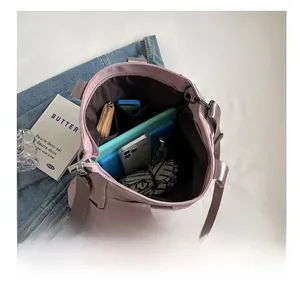 Top view of pink nylon tote interior showing large capacity for tablet and cosmetics