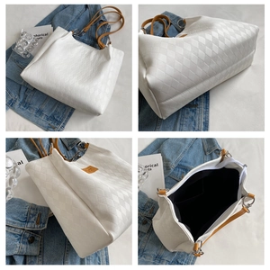 Detailed views of white quilted tote bag with brown straps and spacious black interior