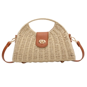 French style woven straw handbag with brown leather trim and golden twist lock closure