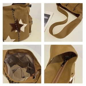 Detail of khaki canvas bag showing star patches, striped lining, and interior zipper pockets