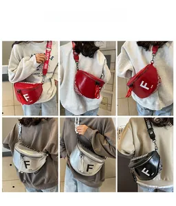 Detailed views of wide jacquard strap saddle bags in red, silver and black variants