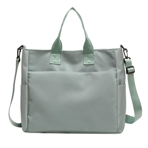 Mint green large nylon tote bag with adjustable shoulder strap and spacious side pockets