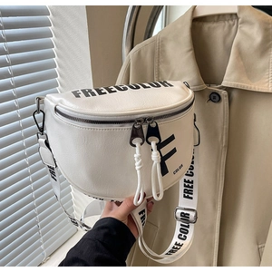 Detail of white PU leather saddle bag with black FREE COLOR text and wide strap