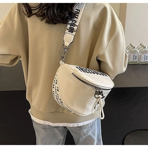 Close-up of white PU leather crossbody bag with bold black FREE COLOR letter printing