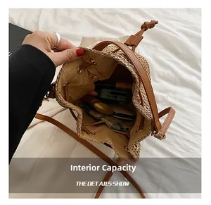 Detailed interior view of a straw bucket bag showing large capacity for daily items