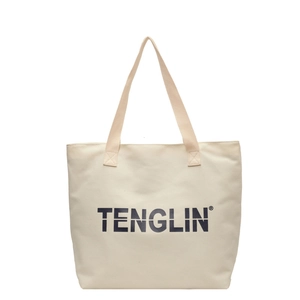 Minimalist cream canvas tote bag with black letter print and durable shoulder straps