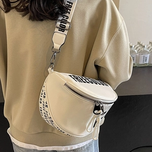 White PU leather saddle bag with wide FREE COLOR letter strap shown on a model