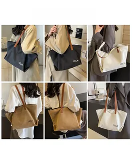 Three minimalist canvas tote bags in black, khaki, and cream with brown leather straps