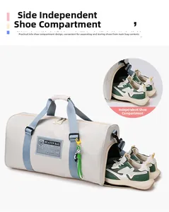 Detail showing the side independent shoe compartment of the cream oxford travel bag