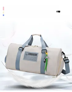Lightweight grey nylon duffle bag with blue straps showing floating feathers for lightness