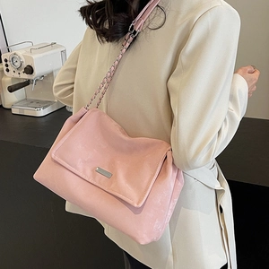 Pink suede crossbody tote bag with silver chain strap and metal flap detail for women