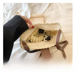 Detailed interior of woven straw tote bag showing zipper closure and large capacity