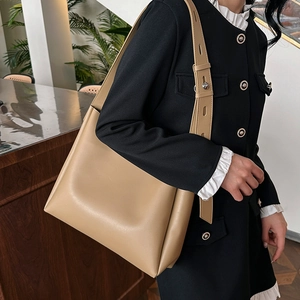 Retro beige leather bucket bag for women with wide shoulder strap and large capacity