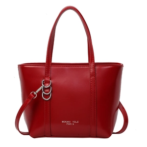 Large red tote bag in glossy faux leather with top handles and adjustable shoulder strap
