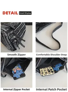 Detail of washed denim tote with multiple zippers and spacious interior compartments
