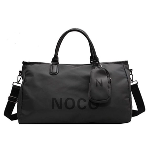 Close-up of black high-capacity fitness bag with Noco logo and matching small pouch