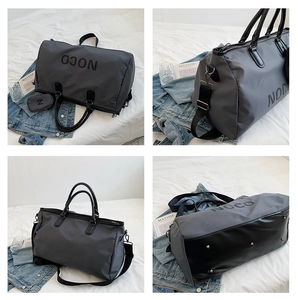 Macro detail of high-capacity waterproof sports bag with NOCO logo and travel accessories