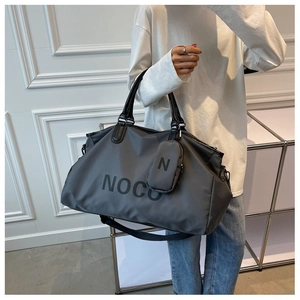 Large dark grey travel bag with small matching pouch and black NOCU lettering