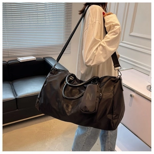 Large capacity black nylon duffel bag with shoulder strap and detachable side pouch