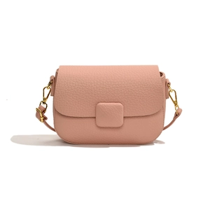 Minimalist dusty pink crossbody bag in litchi grain leather with gold metal hardware